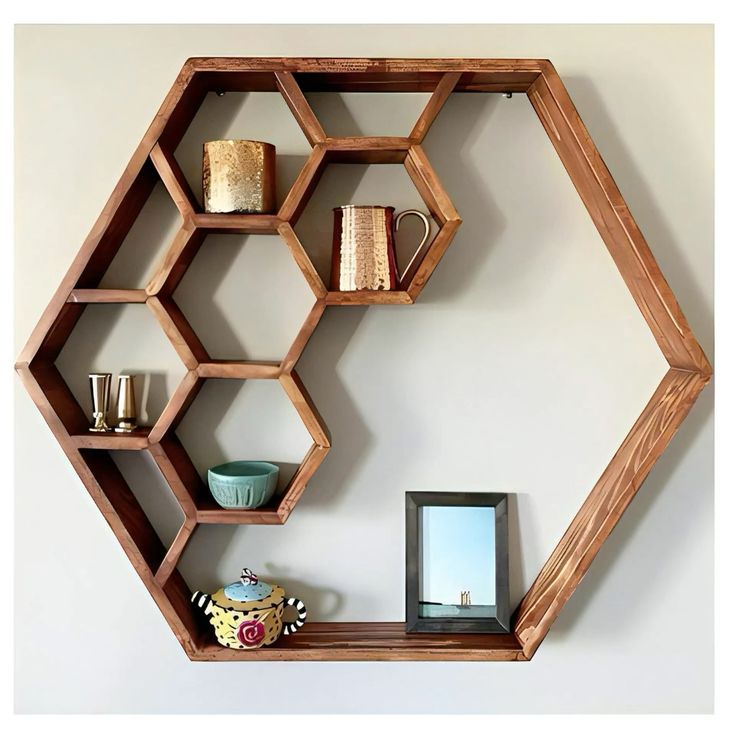 Modular hexagonal wood shelf cluster with plants and ceramic decor