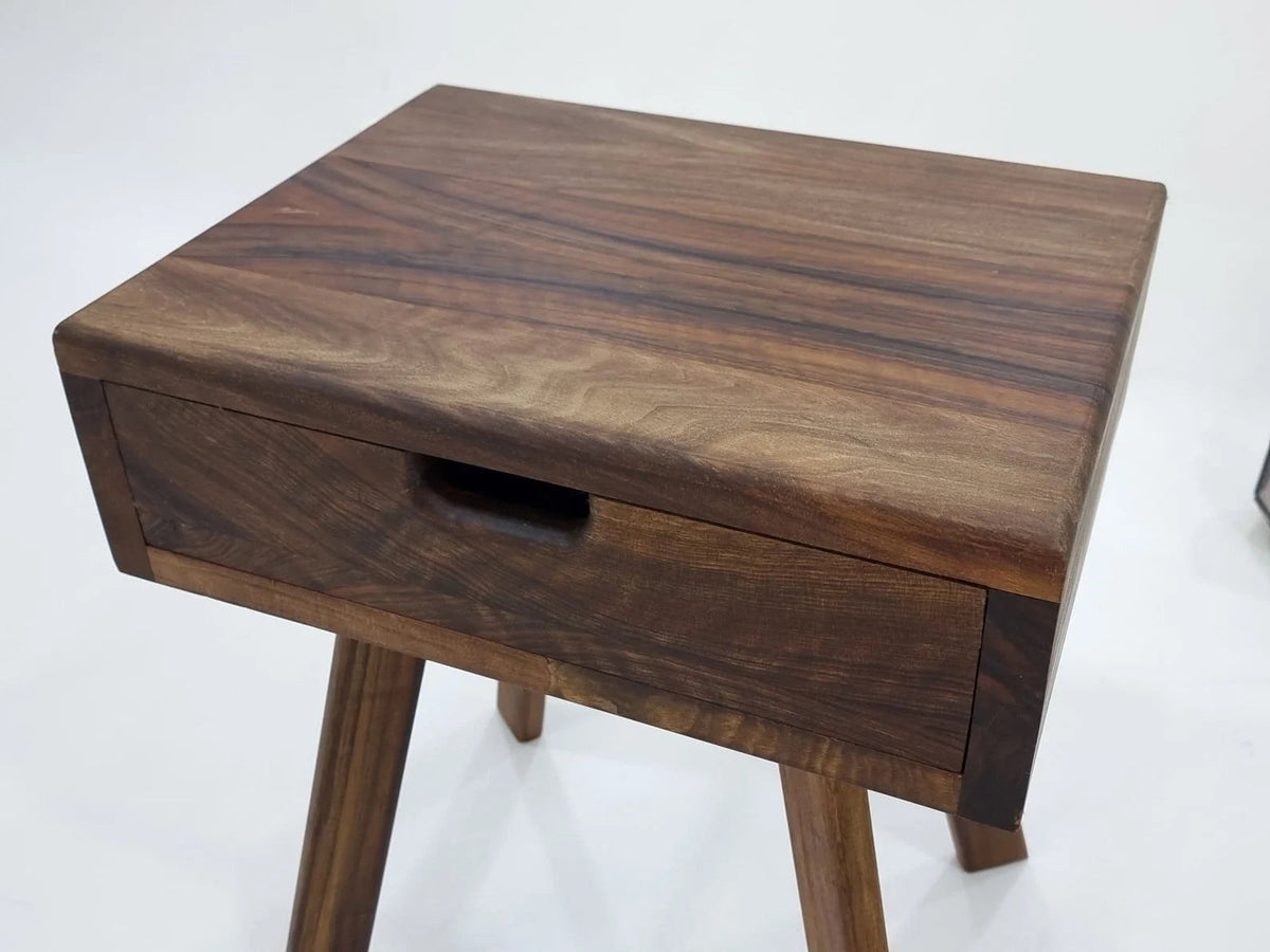 Close-up of walnut drawer table top showing rich natural wood grain